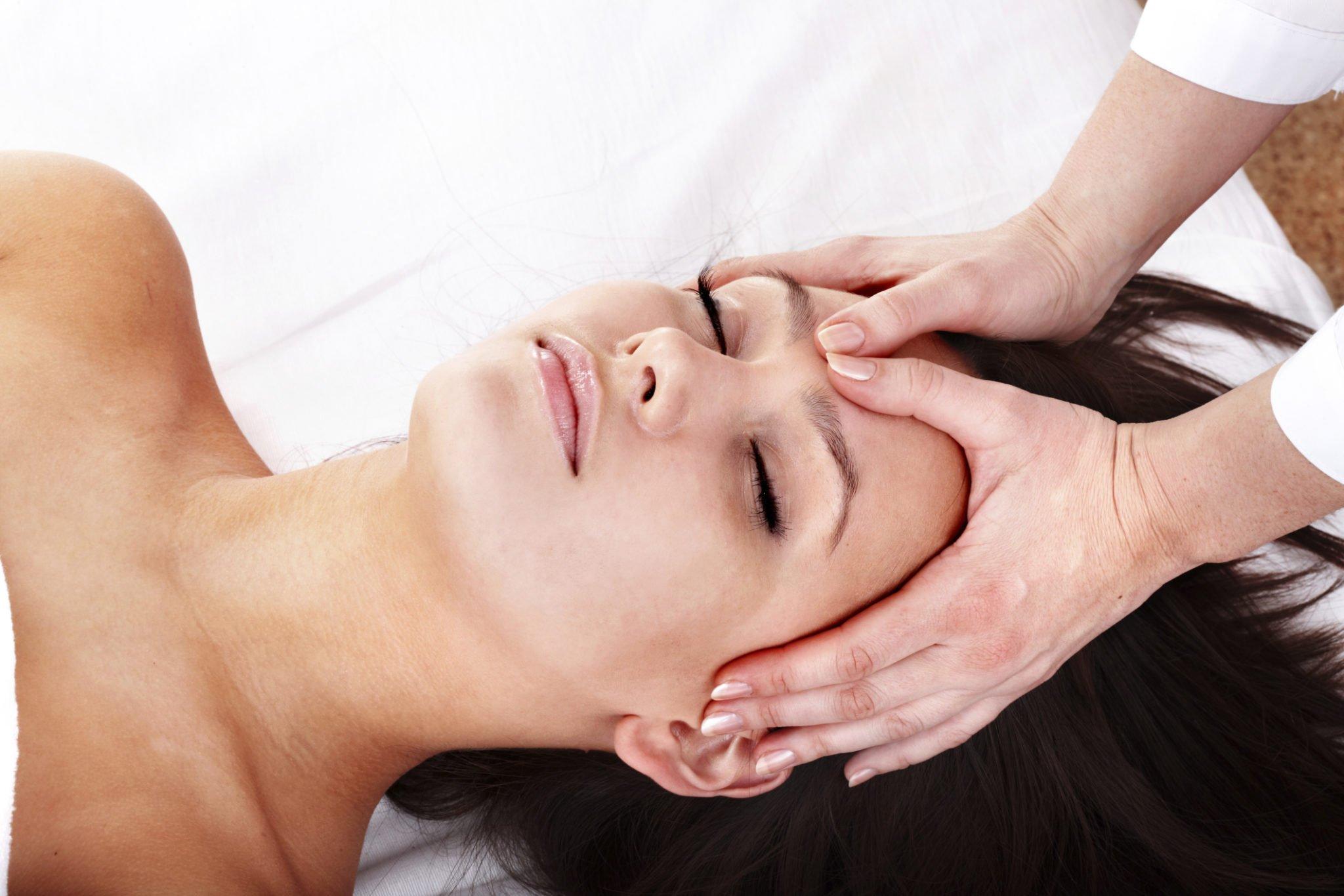 Young woman getting craniosacral therapy